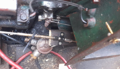 Unsecured throttle cable attached to floating wood